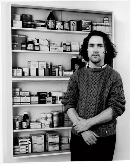 Damien Hirst at the No Sense of Absolute Corruption exhibition, Gagosian Gallery, New York, 1996. Artwork: © Damien Hirst and Science Ltd. All Rights Reserved, DACS 2022  Early Medicine Cabinets